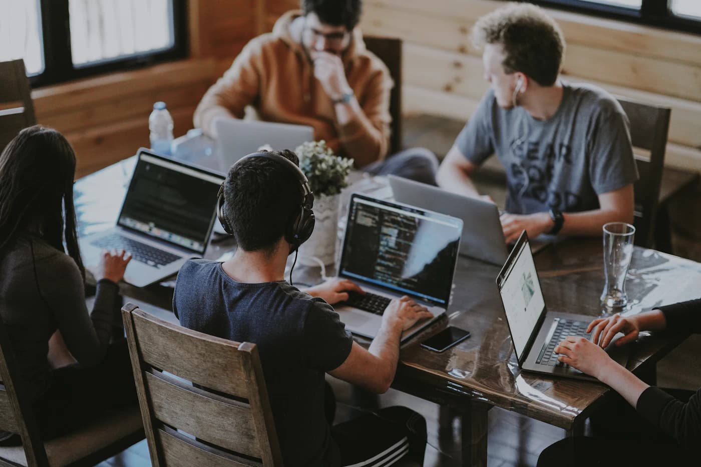A small team working together at laptops
